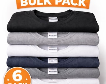 May include: A stack of six folded blank t-shirts in various colors: black, gray, white, and navy blue. The shirts are labeled "Gildan" and are part of a "Bulk Pack". The image also includes text that says "Blank Shirts" and "6 Pack".