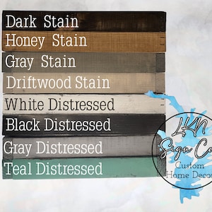 May include: A wood sign with eight different stain and distressed paint colors. The colors are: Dark Stain, Honey Stain, Gray Stain, Driftwood Stain, White Distressed, Black Distressed, Gray Distressed, and Teal Distressed. The sign is labeled with the text "4KN Sign Co. Custom Home Decor".