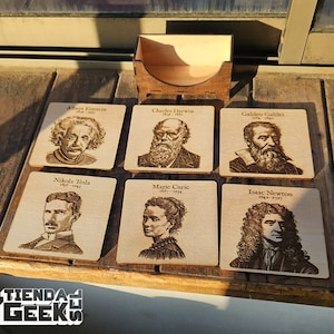 May include: Six wooden coasters featuring portraits of famous scientists, including Albert Einstein, Charles Darwin, Galileo Galilei, Nikola Tesla, Marie Curie, and Isaac Newton. Each coaster has the scientist's name and life dates.