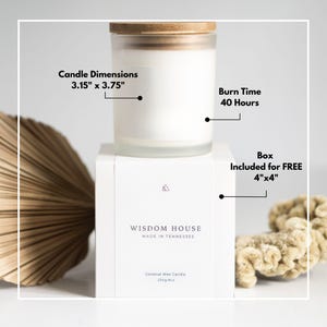 May include: A white candle in a glass jar with a wooden lid, labeled "WISDOM HOUSE MADE IN TENNESSEE." The candle dimensions are 3.15" x 3.75" and has a burn time of 40 hours. The box is included for free and is 4"x4".
