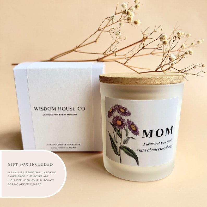 May include: White frosted glass candle jar with a wooden lid. The candle has a floral design and the text "MOM Turns out you were right about everything".