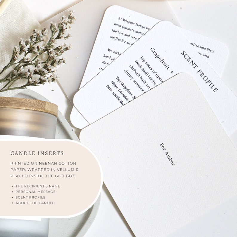May include: Candle insert card with a pink background and the text "CANDLE INSERTS" printed in black. The card also includes the text "PRINTED ON NEENAH COTTON PAPER, WRAPPED IN VELLUM & PLACED INSIDE THE GIFT BOX" and a list of bullet points: "THE RECIPIENT'S NAME", "PERSONAL MESSAGE", "SCENT PROFILE", "ABOUT THE CANDLE".