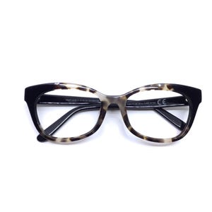 May include: Eyeglasses with a black and tortoiseshell pattern frame. The cat-eye shaped glasses have clear lenses. The arms are black and the frame has a CE marking.