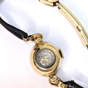 Elegant Vintage Bulova Watch in Original Box  Art Deco Style  Gold Tone with Black Cord Band Can&#39;t be sure but I guess it could be 20&#39;s/30&#39;s