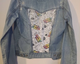 Youth size Medium denim jacket with looney tunes and diamond fringe on back