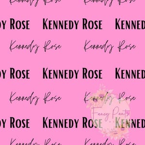 May include: Pink background with the text "Kennedy Rose" repeated multiple times in black.