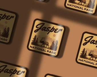 May include: A brown and tan sticker with a vintage design featuring a stylized elk and the text "Jasper National Park".