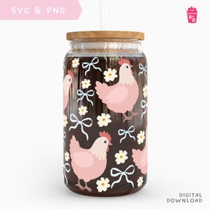 May include: A glass tumbler with a wooden lid and a straw. The tumbler features a pattern of pink chickens, white bows, and daisies on a dark brown background. The words "SVG & PNG" and "DIGITAL DOWNLOAD" are visible.