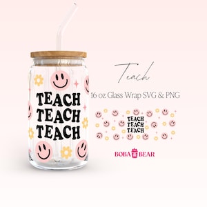 May include: A 16 ounce glass tumbler with a pink and yellow design featuring the word "TEACH" repeated three times and smiley faces. The tumbler has a wooden lid and a clear glass straw.