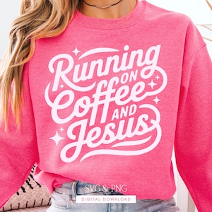 May include: A bright pink sweatshirt with the words "Running on Coffee and Jesus" in white script. The design includes decorative star accents. The bottom of the image includes the text "SVG & PNG DIGITAL DOWNLOAD".