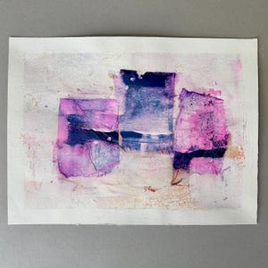 May include: Abstract mixed media artwork on paper. The composition features three overlapping rectangular shapes in shades of purple and blue, set against a textured white background. The artwork has a handmade, collage-like appearance.