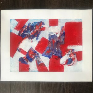 May include: Abstract painting with red, white, and blue paint. The painting has a textured surface and appears to be made with a brush.