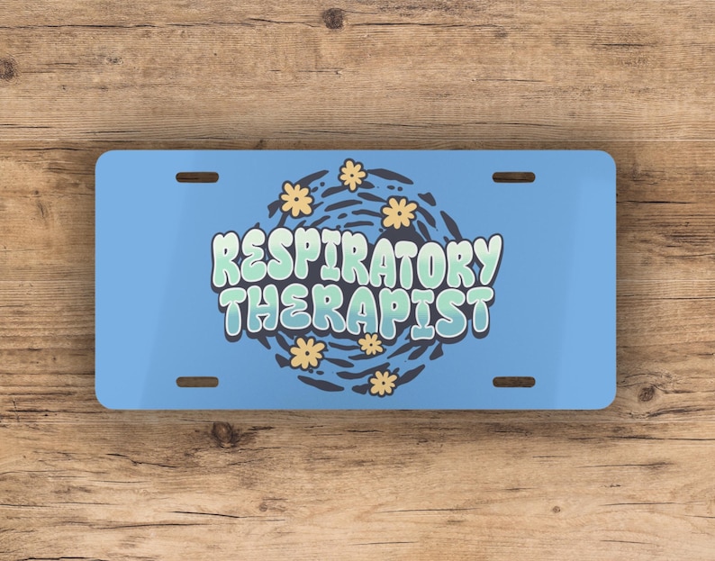 May include: Blue and white license plate with the text "Respiratory Therapist" in a stylized font with a swirl design and yellow flowers.