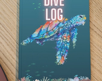 May include: Teal blue cover with the text "DIVE LOG" in pink. A colorful watercolor painting of a sea turtle swimming in the ocean with coral and fish at the bottom.