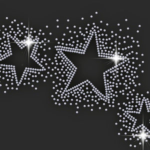 May include: Three sparkling silver stars made of rhinestones on a black background.
