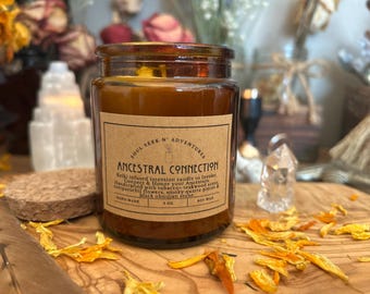 May include: A brown glass jar candle with a label that reads "Ancestral Connection." The candle is handcrafted with tobacco, teakwood, and other natural ingredients. The candle is 3 oz.
