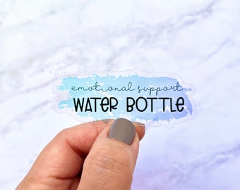 May include: A clear sticker with a blue watercolor background and the text "emotional support water bottle" in black.