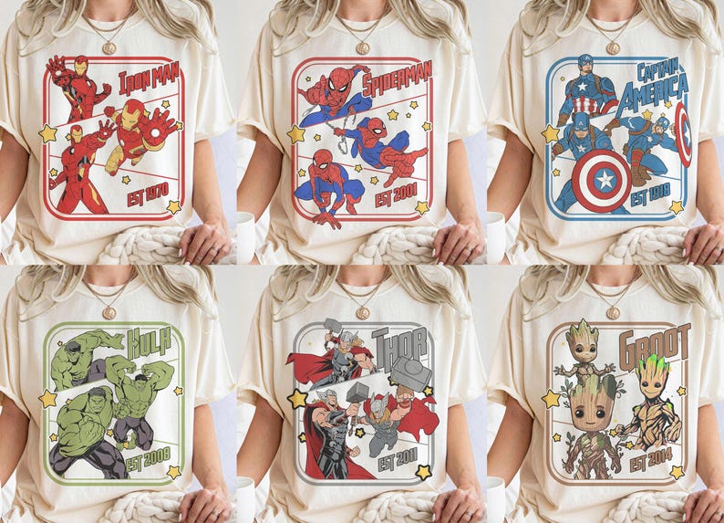 Puede incluir: Camisetas color crema con dise&ntilde;os de superh&eacute;roes de Marvel. Cada camiseta muestra un personaje o equipo diferente, incluyendo Iron Man, Spider-Man, Capit&aacute;n Am&eacute;rica, Hulk, Thor y Groot, con el nombre del personaje y el a&ntilde;o de establecimiento.