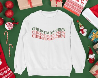 May include: White Christmas crew sweatshirt with the text "Christmas Crew" repeated three times in a green and pink gradient.