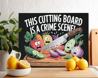 May include: A black cutting board with the text "This cutting board is a crime scene!"  A knife is sticking into the board, and there are various vegetables and fruits on the board, including a tomato, a green pepper, a red pepper, a cucumber, and a red onion.