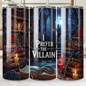 May include: A stainless steel tumbler with a wraparound design featuring a gothic library scene with books, roses, candles, and the text "I Prefer the Villain". The design includes a snake, a glass of red wine, and a chain.