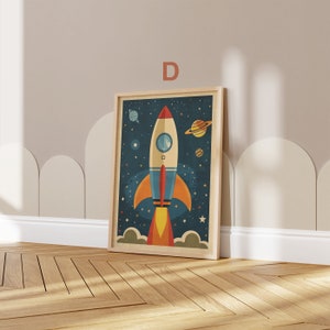 May include: A framed illustration of a red and blue rocket ship flying through space with stars and planets. The rocket ship has a window and a flame coming out of the back. The background is a dark blue with white stars.