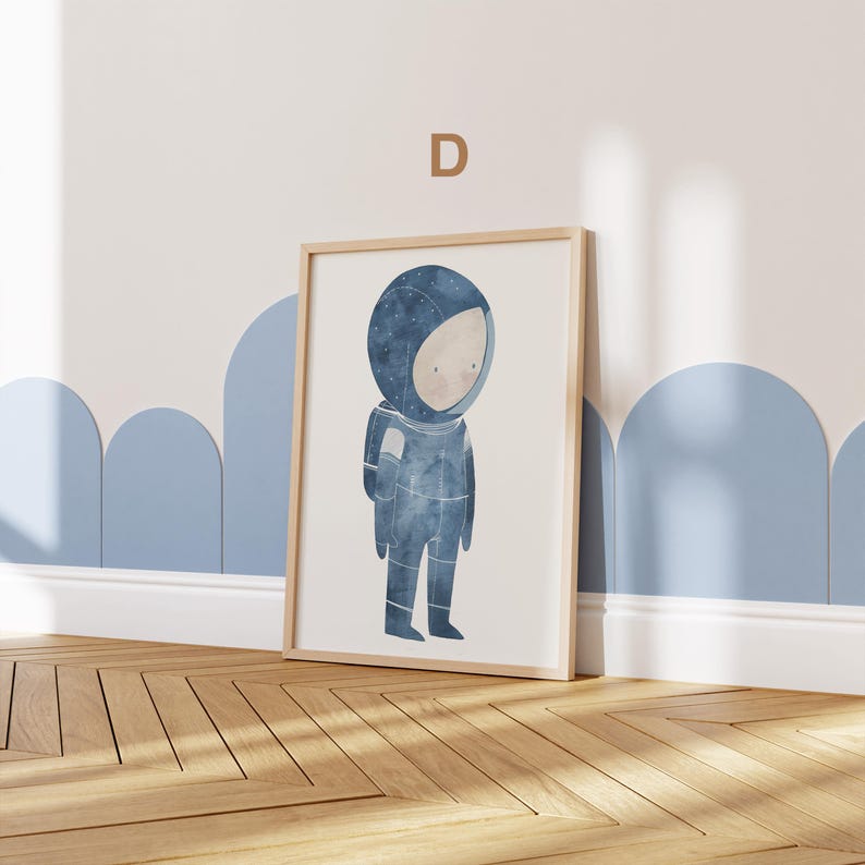May include: A framed illustration of a child dressed as an astronaut with a blue and white spacesuit. The background is white with a light blue border.