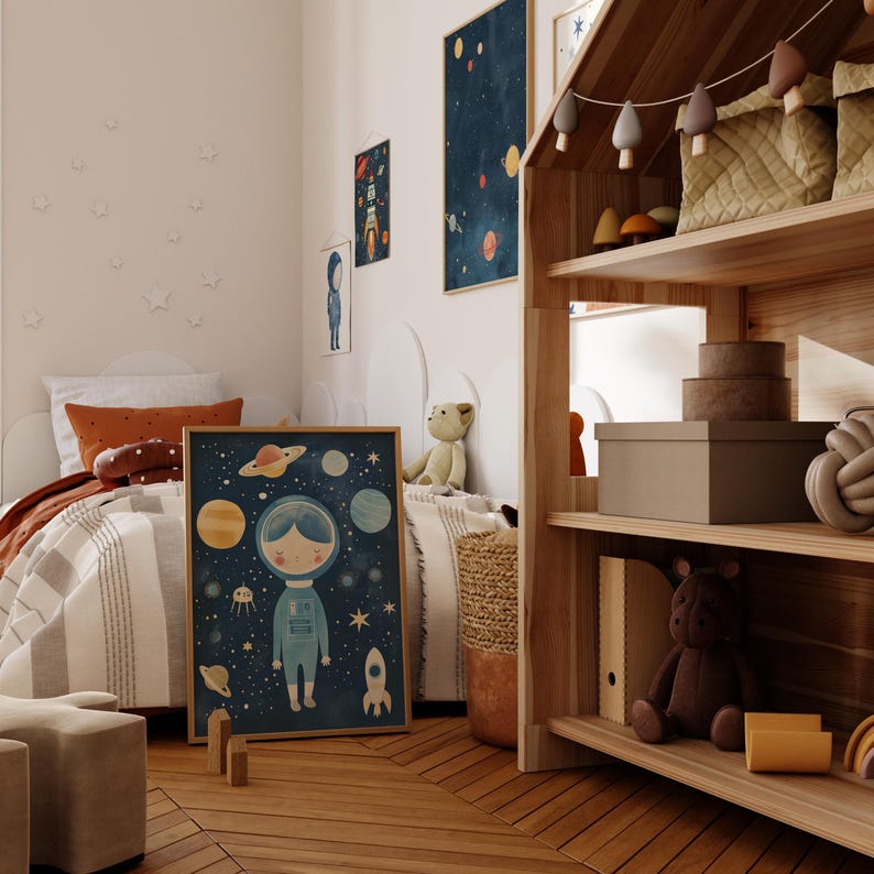 May include: A child's bedroom featuring a white and grey striped bedspread, a brown and orange throw pillow, and a framed print depicting a girl in a spacesuit surrounded by planets and stars. A wooden doll's house with shelves is positioned on the right side of the image.