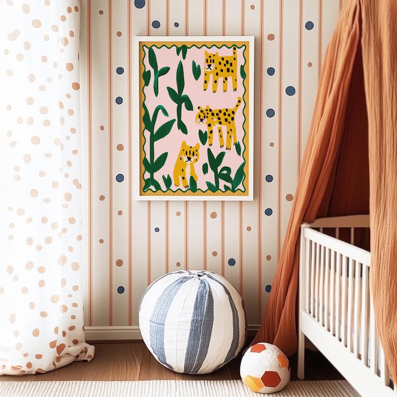 May include: A framed illustration of three leopards in a jungle setting. The leopards are depicted in a whimsical style with bright colors and bold outlines. The frame is white with a decorative border.