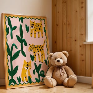 May include: A framed print with a pink background and green leaves. Three yellow and black leopards are depicted in the print. The print is hanging on a wall next to a wooden ladder.