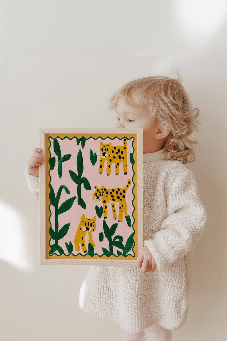 May include: A framed print with a pink background featuring three yellow and green leopards in a jungle setting.