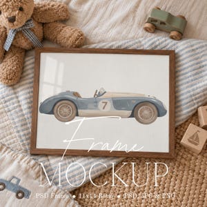May include: A framed print featuring a vintage-style blue and cream race car with the number 7 on the side. The artwork is displayed in a dark wood frame, with white text overlay reading Frame MOCKUP 11x14 Ratio PSD JPG & PNG.