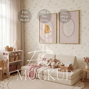 May include: A mockup scene featuring a light-colored modular sofa, a rug, and a small wooden chair. Two framed prints hang on the wall, one with a teddy bear illustration and the other with text. The scene is decorated with a pink blanket, pillows, and a stuffed bunny.