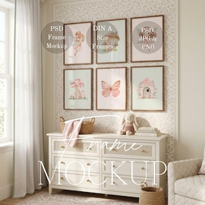 May include: Six framed art prints with fairy tale illustrations, including a fairy, mushroom, and butterfly. The frames are brown, and the prints have soft pastel colours. A white chest of drawers with gold knobs and a stuffed bunny are in the foreground.