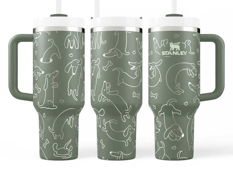 A set of three green tumblers with a repeating pattern of dogs and bones printed on them.