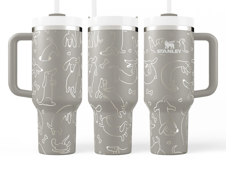A set of three gray tumblers with a repeating pattern of dogs and bones printed on them.
