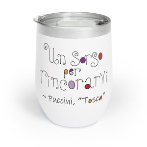 May include: White stainless steel wine tumbler with a black and white quote in Italian that reads "Un sorso per rincorarvi ~ Puccini, "Tosca""