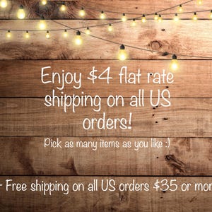 May include: A rustic wooden background with a string of white lights. Text reads: "Enjoy &pound;4 flat rate shipping on all UK orders! Pick as many items as you like :) + Free shipping on all UK orders &pound;35 or more!"