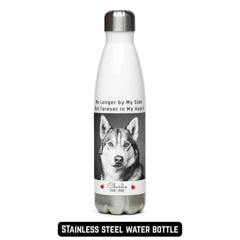 May include: White stainless steel water bottle with a black and white image of a dog. The bottle has the text "No Longer by My Side But Forever in My Heart" and "Charlie 2016-2026". The bottom of the bottle has the text "STAINLESS STEEL WATER BOTTLE".