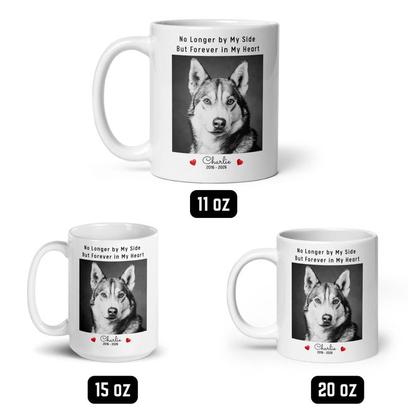May include: White ceramic mugs with a black and white image of a dog, the text "No Longer by My Side But Forever in My Heart", and the name "Charlie" with dates. Available in 11 oz, 15 oz, and 20 oz sizes.