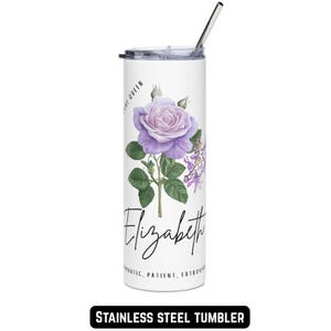 May include: White stainless steel tumbler featuring a purple rose and wisteria illustration. The name "Elizabeth" is written in cursive below the floral design. The tumbler includes a silver straw and the words "Romantic, Patient, Extroverted".