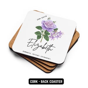 May include: A stack of square coasters with a white top and cork backing. The top coaster features a purple rose illustration, the name "Elizabeth", and the words "June Queen". The bottom of the coaster reads "CORK - BACK COASTER".