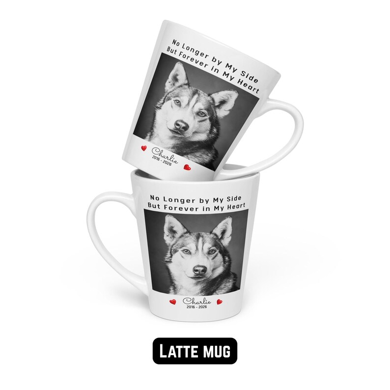 May include: Two white latte mugs stacked, each featuring a black and white photo of a dog. The mugs have the text "No Longer by My Side But Forever in My Heart" and the name "Charlie" with dates. The bottom mug has the text "LATTE MUG".