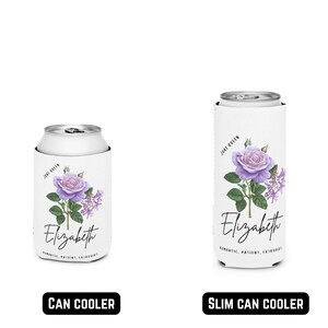 May include: White can coolers featuring a purple rose design and the name "Elizabeth" in script. One is for a standard can, the other for a slim can. Text reads "June Queen" and "Romantic, Patient, Extrovert."