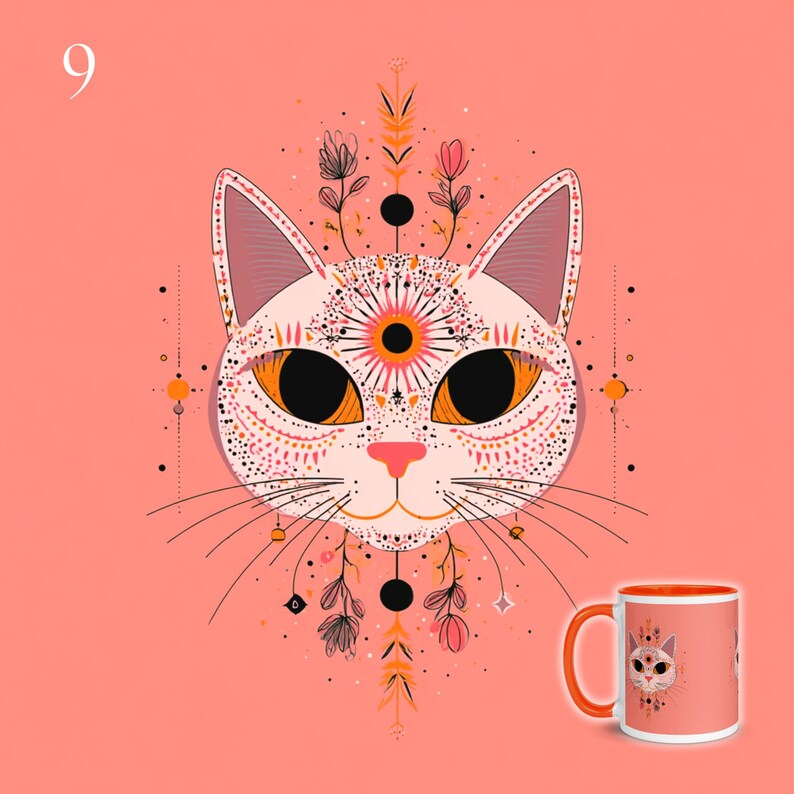 May include: A ceramic mug with an orange handle and rim, featuring a graphic illustration of a cat face with large orange eyes, a pink nose, and intricate black and orange floral and geometric patterns extending above and below the head.