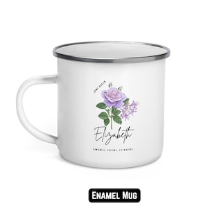 May include: White enamel mug with a silver rim and handle. The mug features a purple rose and other flowers, the name "Elizabeth", and the words "Romantic, Patient, Extrovert." The text "June Queen" is also present.