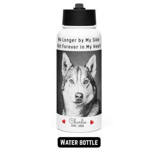 May include: A white water bottle with a black lid features a black and white portrait of a dog. The text "No Longer by My Side But Forever in My Heart" is above the dog's image. Below the image is the name "Charlie" and the years "2016-2026". The words "WATER BOTTLE" are at the bottom.