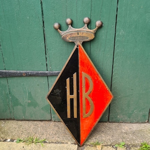 Enamel on porcelain and bronze HB and crown sign