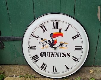 Large Guinness tin clock/guinness time