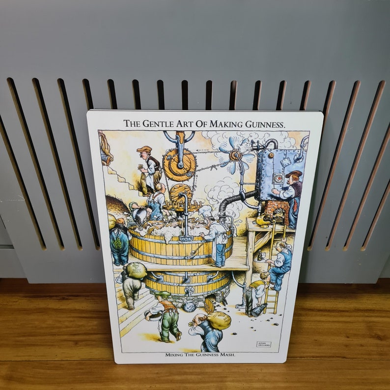May include: A vintage-style illustration depicting the process of making Guinness beer. The image shows a cartoon-like depiction of a brewery with workers and machinery. The text reads "The Gentle Art of Making Guinness. Mixing the Guinness Mash."